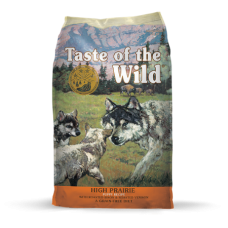 Taste of the Wild High Prairie Puppy Recipe with Roasted Bison & Roasted Venison Dry Dog Food. Colorful pet food bag. Outdoor scene. 