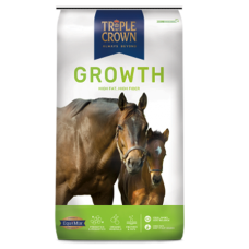 Triple Crown Growth Horse Feed. Green feed bag. Two brown horses.