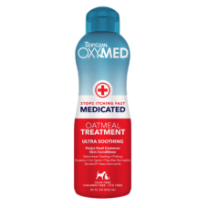 TropiClean Oxymed Medicated Oatmeal Treatment. Blue and red plastic bottle. Grooming product for pets.