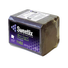 Lone Star Sweetlix Bloat Guard Block. Brown compress block. Purple product label. Livestock supplement.