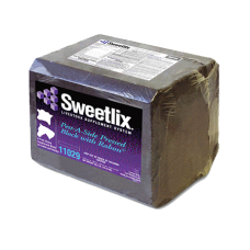 Lone Star Sweetlix Rabon Fly Block. Fly control for livestock. Brown compress block. Purple product label.